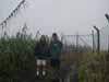 Why do they call this the rain forest? Robyn & Roy in the rain at the top of Des Veaux Peak by the radio tower; Roy is Tina's boyfriend and was our guide on this and several other adventures