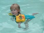 Zoe swimming in Grandpa's pool. Utterly fearless. 6/2001