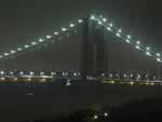 Looking out the window toward the near tower of the George Washington Bridge on a foggy night