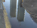 Reflected in a puddle on Church Street, taken while walking to the WTC PATH station on my way home from work, July 6 2001