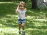 Zoe doing her best bionic woman impression in Mom & Dad's back yard, 7/12/02