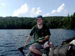 Froehler paddling the canoe that, miraculously, awaited us at Queer Lake. We took all the packs around the point to the campsite and went back for Holly and Robyn.