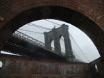 The Brooklyn Bridge, from within a strange architectural remnant on the waterfront