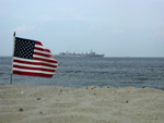 Watching Navy ships depart from the beach at Sandy Hook, 6/30/03