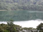 Laguna Botos, a lake filling an older crater farther up the volcano. Look out for falling stick figures.