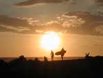 A father and son staying at the lodge would go surfing before dinner every night