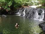 After a few hours of hiking in 300% humidity, Robyn enjoys a dip in a quiet jungle pool